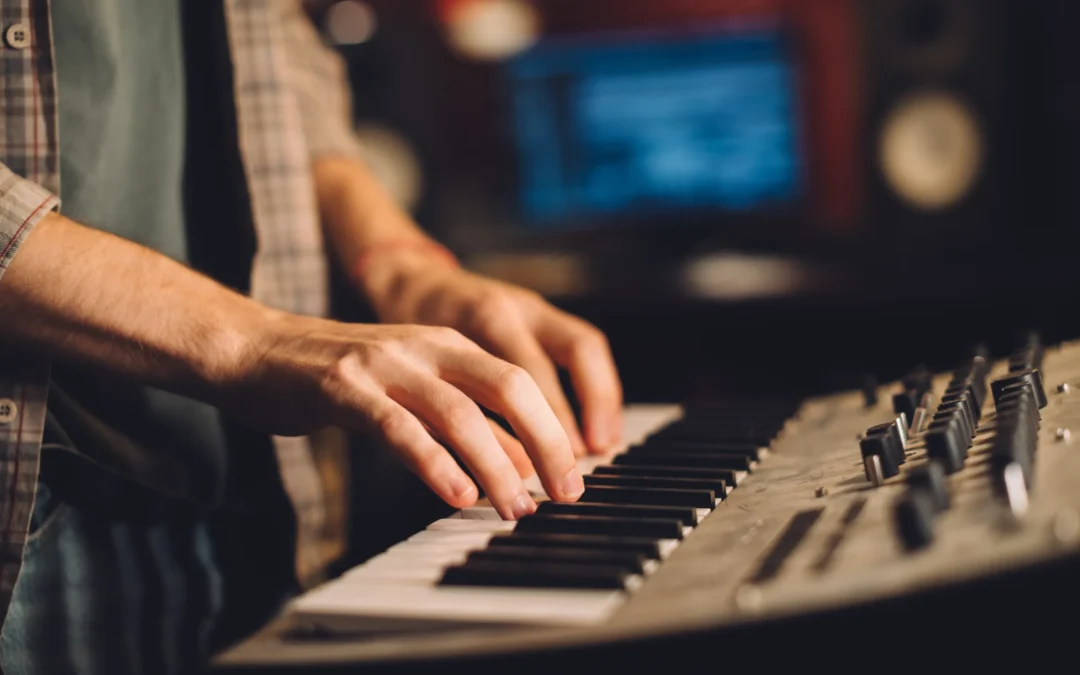 person playing piano keyboard